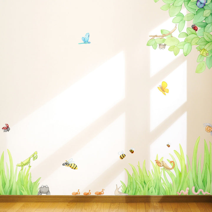 Bug and insect wall decals shown with leaves and grass